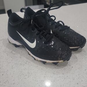 Nike Kids Black and White Cleats.